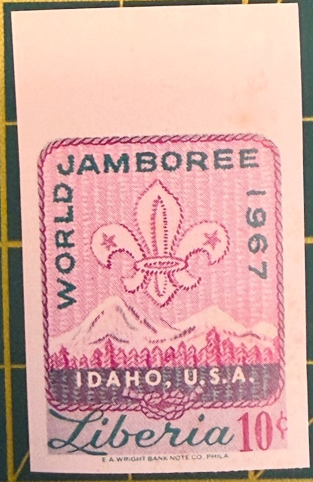Jamboree emblem over mountains